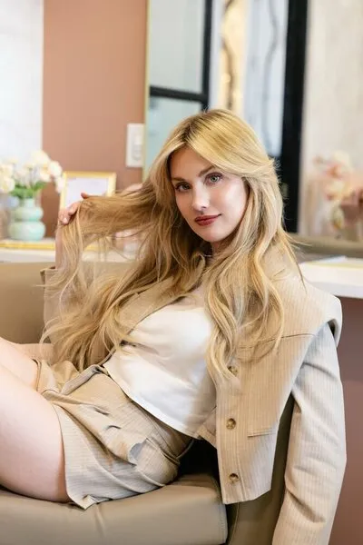 Whitney, founder of Gilded Locks, in her Grapevine salon